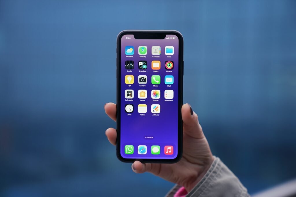 Hand holding an iPhone